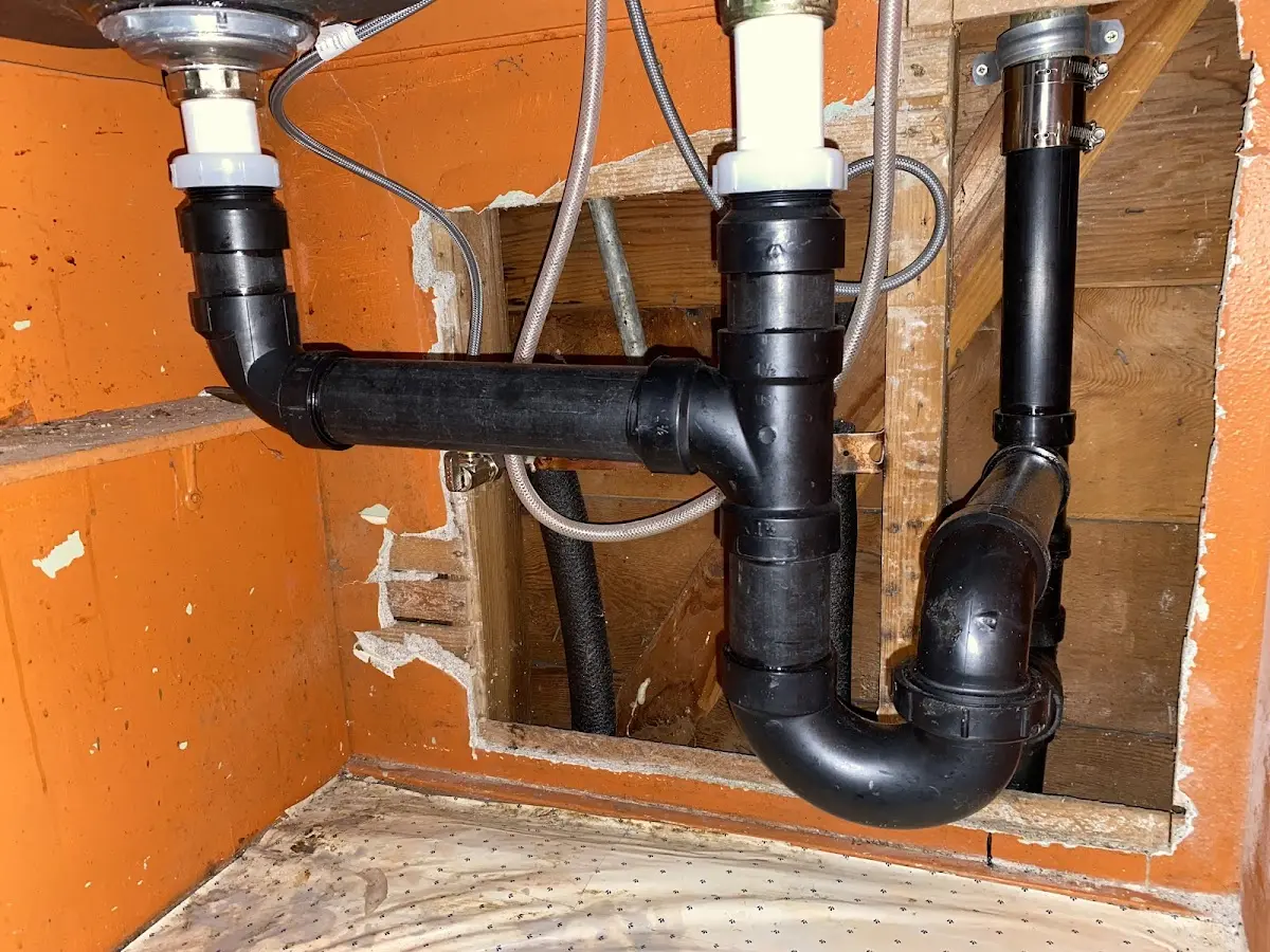 Professional Garbage Disposal Repair equipment and tools on the job in Firestone